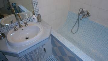 Bathtub, hair dryer, towels, soap