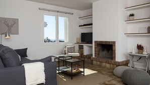A modern living room with a sofa, coffee table, fireplace, and shelves. - Twin villas with large pool and sea views near Barcelona. Free wifi, a / c (Sant Pol de Mar Barcelona)