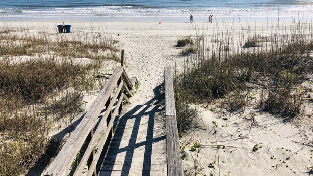 A wooden boardwalk leading to a sandy beach with sparse vegetation. - GOIN COASTAL Beach House, 3/2, Sleeps 10, 3 min Walk To The Beach  (St. Augustine)