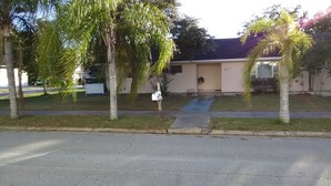 A residential house with a mailbox, a small front yard, and a driveway. - Clean And Comfortable  (Sebring)