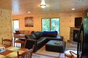 Smart TV, fireplace, table football, books