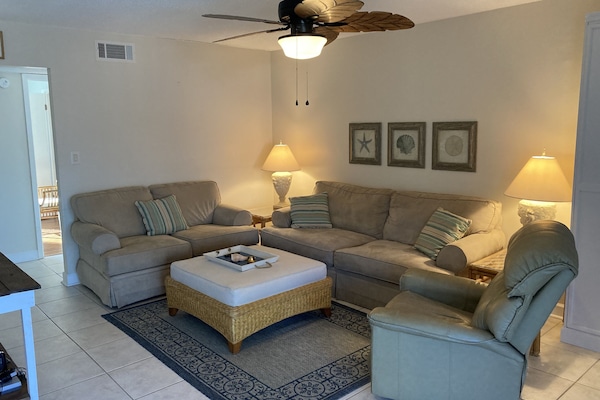 Comfortable living room with plenty of seating.