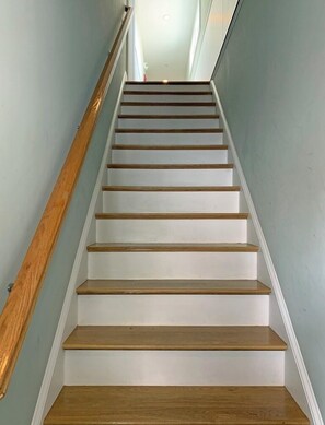 Stairs lead upwards, offering a glimpse into the property's interior.