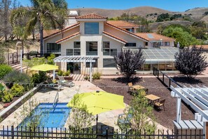 A house with a swimming pool, patio, and a view of the hills. - Getaway at the Highlands-Heated Pool/In ground Jacuzzi (Nipomo)