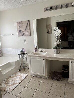 Bathtub, hair dryer, towels, soap