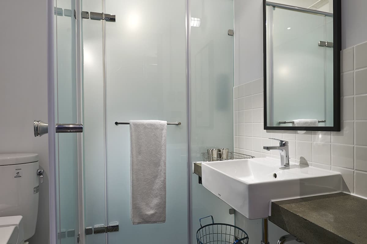 hair dryer, slippers, towels, shampoo