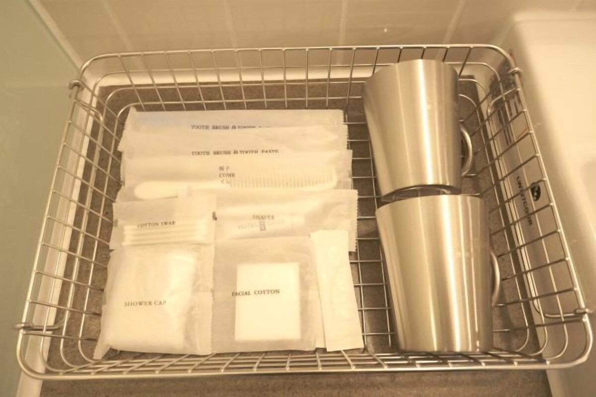 Hair dryer, slippers, towels, shampoo