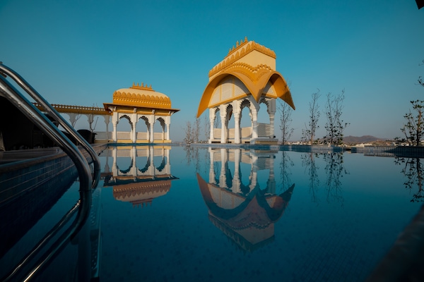 Outdoor pool, open 7:00 AM to 10:00 PM, pool umbrellas