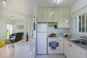Villa | Private kitchen | Fridge, microwave, oven, stovetop