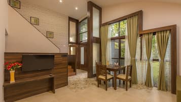 Luxury Room, Accessible, Garden View | Living area | Flat-screen TV