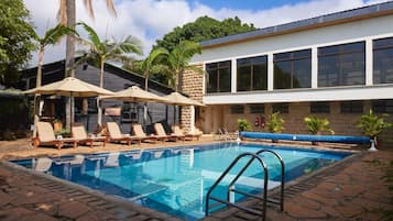 Outdoor pool, open 6:00 AM to 6:00 PM, pool umbrellas, sun loungers