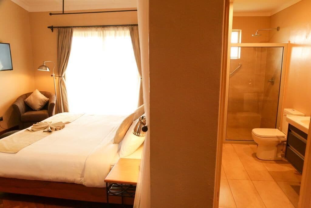 Deluxe Double Room, Patio (Pilot Wing) | Bathroom | Shower, free toiletries, hair dryer, slippers