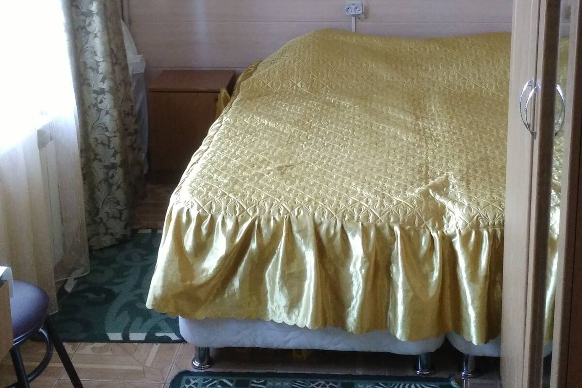 Desk, iron/ironing board, bed sheets