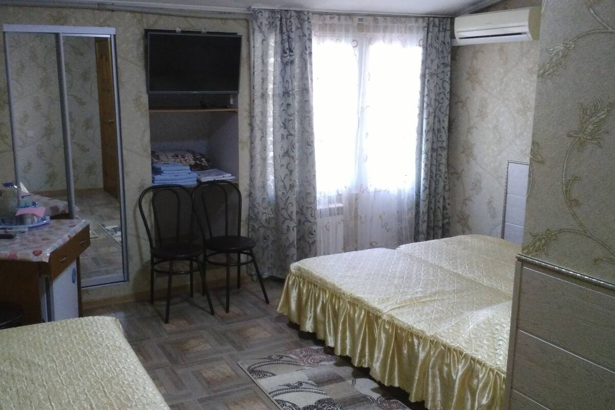 Desk, iron/ironing board, bed sheets