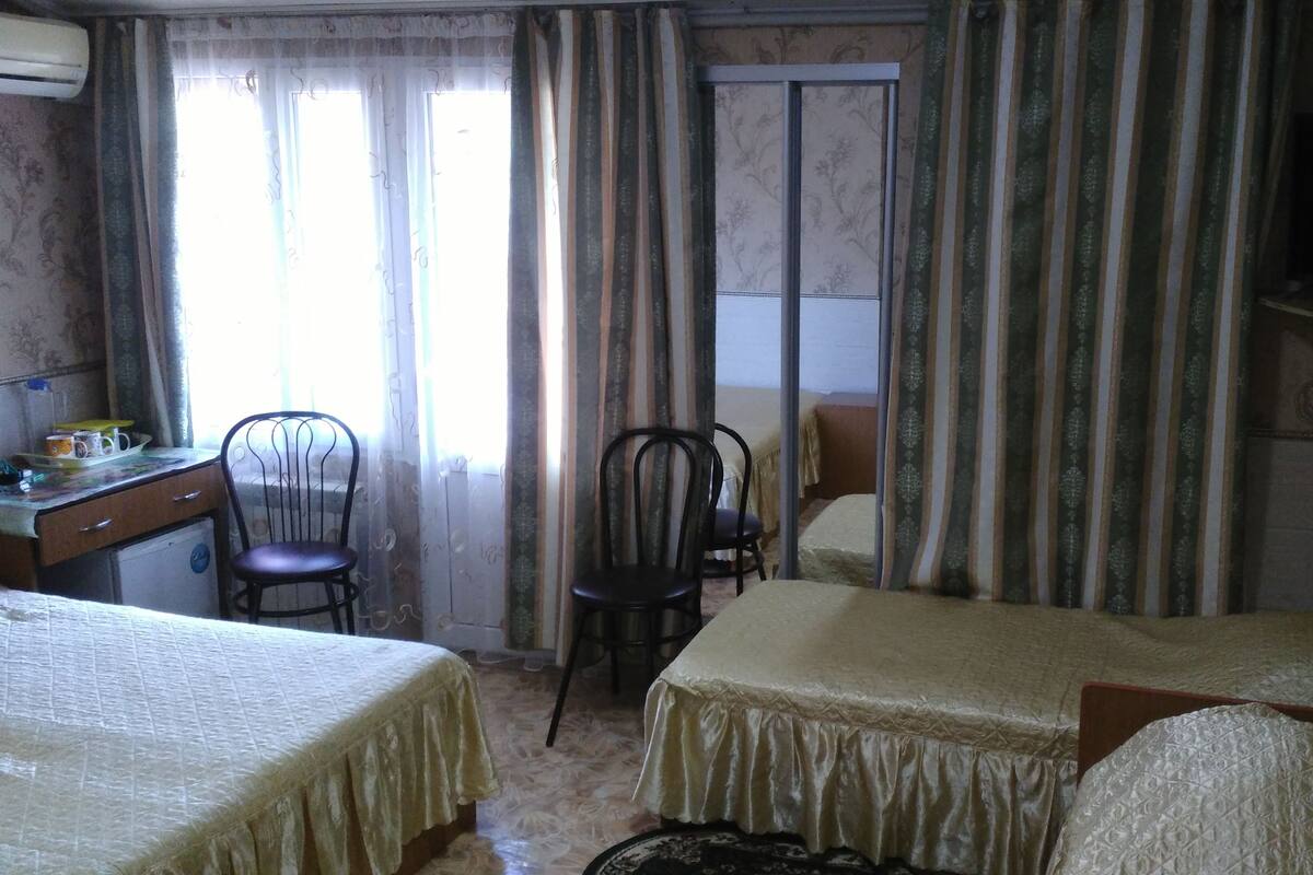 Desk, iron/ironing board, bed sheets