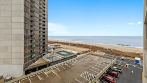 A parking area with a view of the beach and ocean. - DAILY ACTIVITIES & LINENS INCLUDED*! Seventh floor, 2 bedroom, 2 bath condo one back from ocean. (Ocean City)