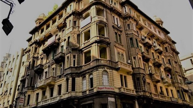 A multi-story building with ornate architectural details, including balconies and decorative moldings. - Cheers Hostel Cairo (Cairo)