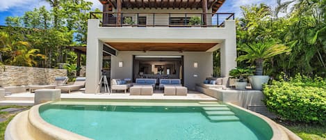 Outdoor pool, an infinity pool, pool loungers