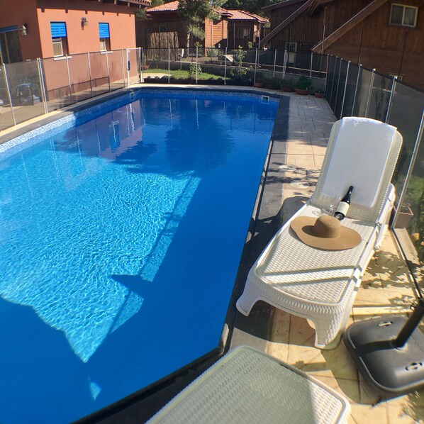 Seasonal outdoor pool, pool umbrellas, pool loungers