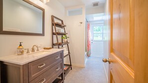 A bathroom with a vanity, a mirror, a towel rack, and a shower curtain. - Suncrest House near beautiful Trinity Alps Wilderness Area (Junction City)