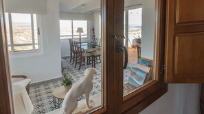Enjoy a view of the outdoors from the comfort of your room, with a dining area and a small table for relaxation.
