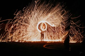 A person performing a fire-breathing act with a circular fire pattern. - Villa 865 + (Marrakech)