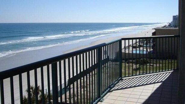 A balcony with a view of the beach and ocean. - Beautiful Daytona Ocean-Front Condo-Everything You Can Imagine (Daytona Beach Shores)