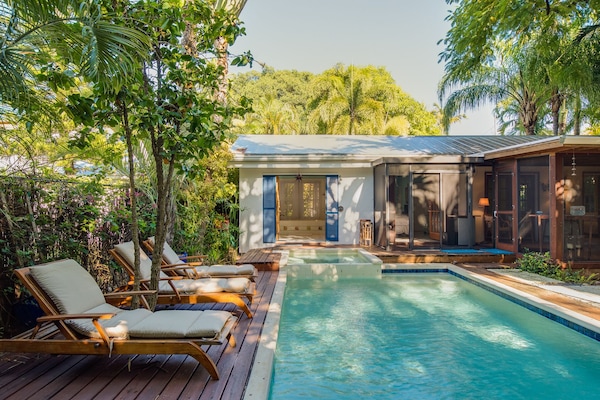 Large private pool and hot tub in the back yard overlooking the garden.
