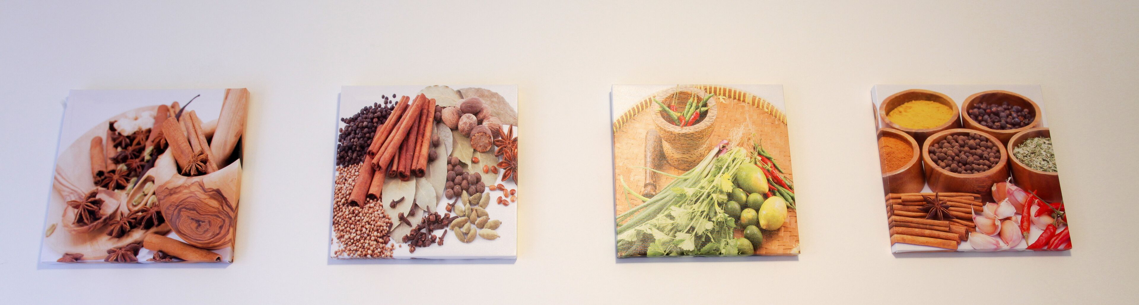 Four framed pictures of various spices and herbs.