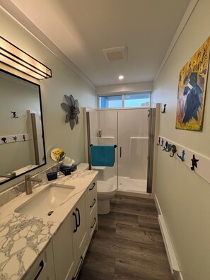 Shower, hair dryer, towels, soap