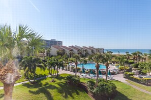A resort with a pool, palm trees, and a beach view. - Siesta Dunes 5-303, Come enjoy our little piece of Paradise! (Siesta Key)