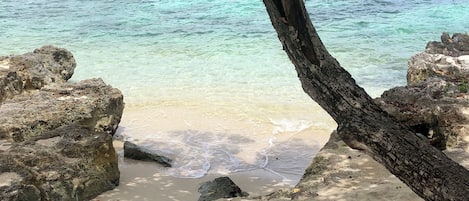On the beach, sun loungers, beach towels