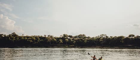 A calm river with kayaks.
