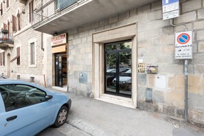 Stroll to Gelateria 'Pinguino' from this charming building with a balcony and windows with shutters.