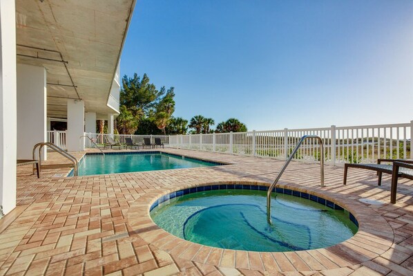 A swimming pool with a brick deck, a covered area, and a white fence. -
Top-Floor Gulf-Front Oasis♥ Panoramic Balcony Sunsets, Pool♥Few Steps To Sand (Treasure Island)