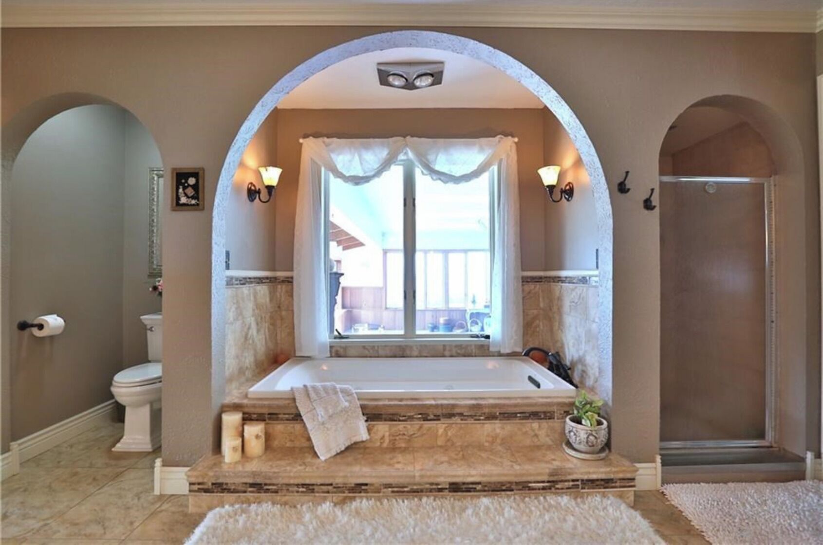 Bathtub, jetted bath, towels, toilet paper