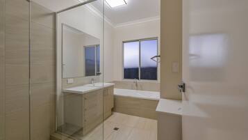 Bathtub, hair dryer, towels