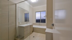 Bathtub, hair dryer, towels