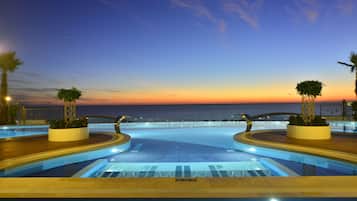 Indoor pool, outdoor pool, open 9:00 AM to 6:00 PM, pool umbrellas