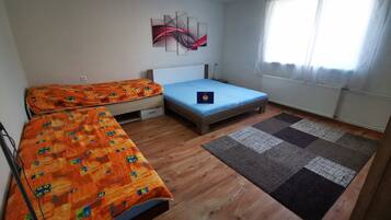 2 bedrooms, blackout curtains, soundproofing, iron/ironing board