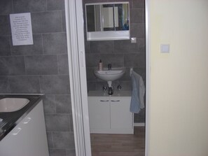 Shower, towels, soap, toilet paper
