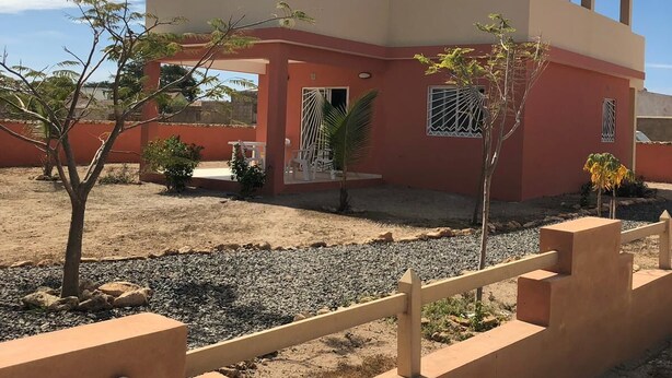 A two-story building with a flat roof and a balcony. - Bahari 1st floor mountain, sea and riviera view (3 p) (Morro)