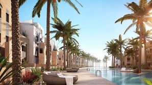 Un resort con piscina, palmeras y edificios modernos.