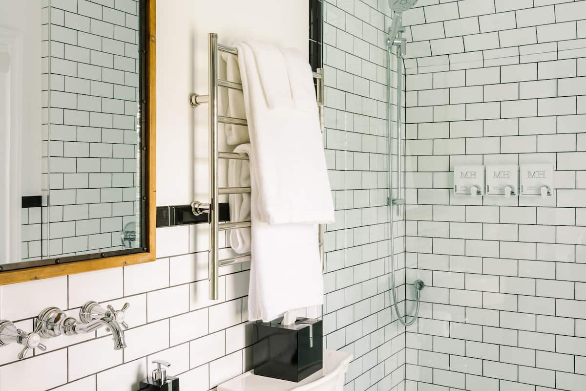 designer toiletries, hair dryer, bathrobes, slippers