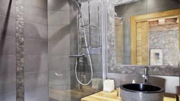 Bathtub, hair dryer, towels, soap