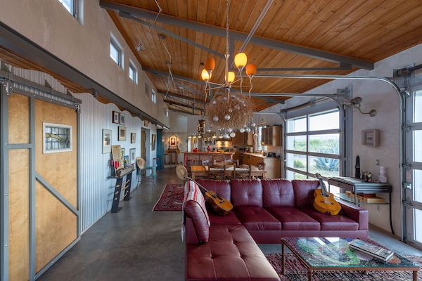 another view of the living area, dinning area and kitchen