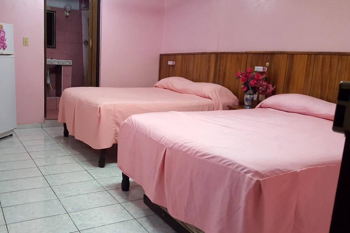 Family Quadruple Room, 2 Queen Beds, Non Smoking, Sea View | 1 bedroom, minibar, individually decorated, individually furnished