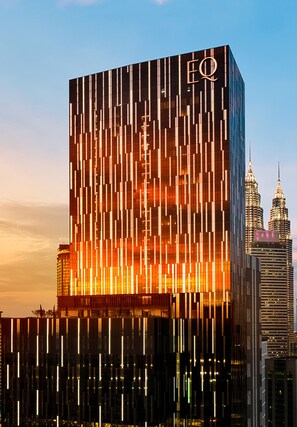 A modern skyscraper with a distinctive vertical line pattern and the EQ logo. - EQ Kuala Lumpur (Kuala Lumpur)