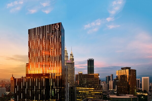 A modern skyscraper with a distinctive vertical design and a prominent logo at the top. - EQ Kuala Lumpur (Kuala Lumpur)