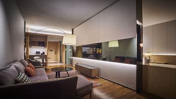 A modern hotel lobby with a sofa, coffee table, and a reception desk.